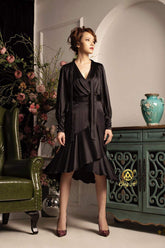 Silk wrap dress with flared hem and long sleeves in soft satin finish for elegant occasions